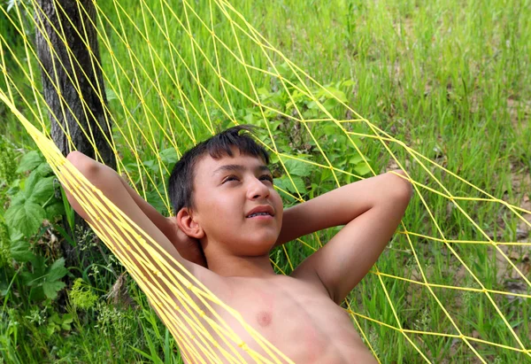 Boy relaxing in hammock — Stock Photo, Image