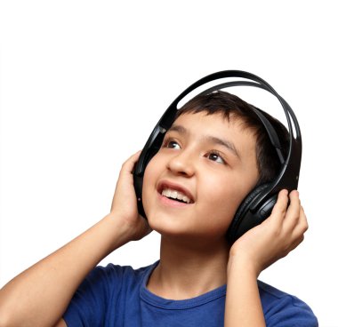 Boy listening music in headphones clipart