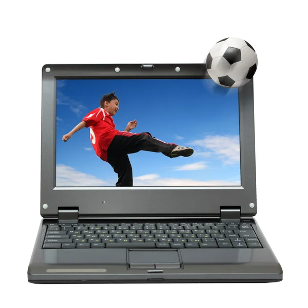 Laptop com menino jogando futebol — Fotografia de Stock