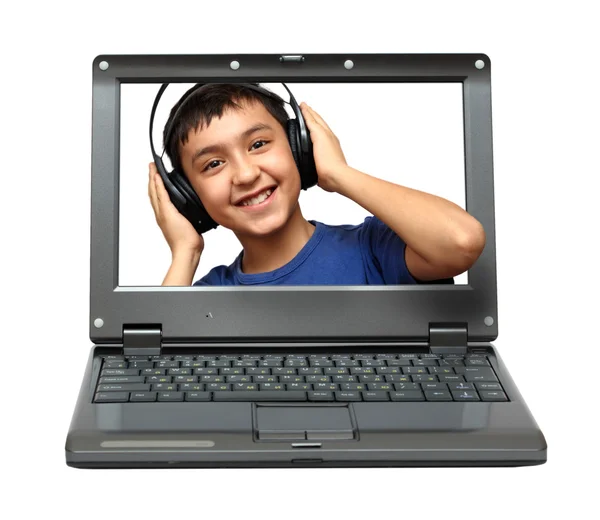 Φορητό υπολογιστή με το παιδί, ακούγοντας μουσική — Φωτογραφία Αρχείου