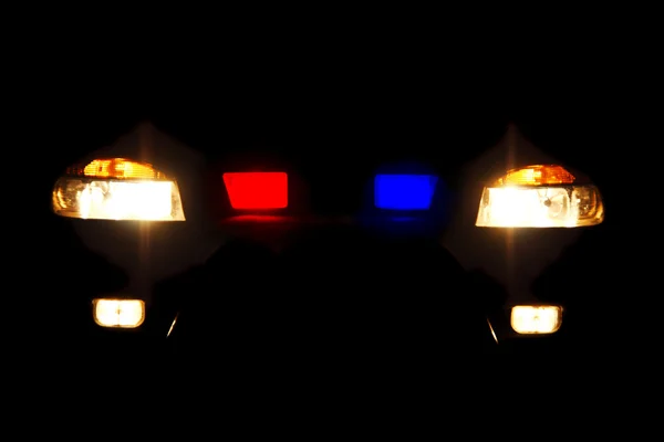 Bright headlights of police car — Stock Photo, Image