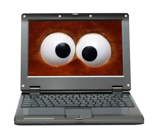 Ноутбук з веселими очима на екрані — стокове фото