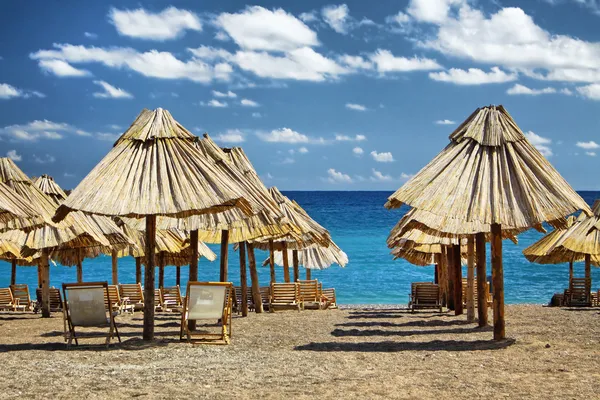 stock image Summer beach with chairs and umbrellas in Montenegro