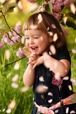 Little girl in garden clipart