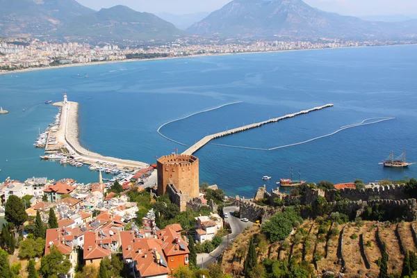 Port Alanya and red brick tower — Stock Photo, Image