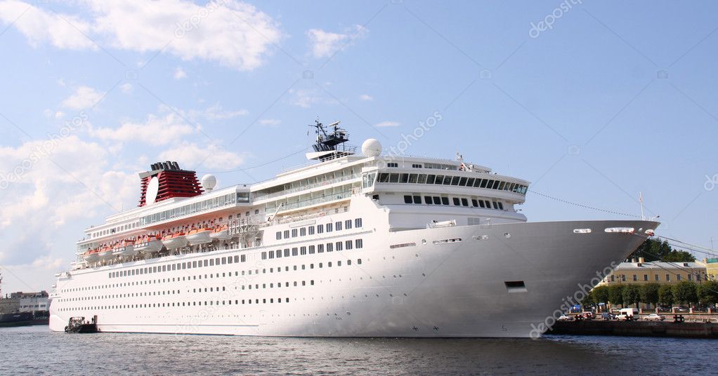 Luxury white cruise ship shot at angle at water level