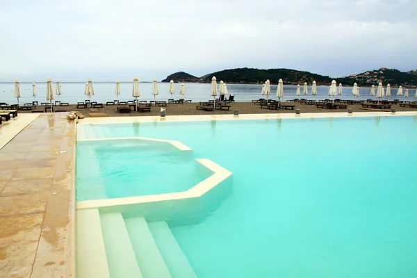 Tropical swimming pool near the beach — Stock Photo, Image