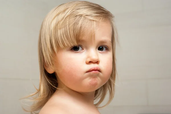 Cute little girl making a face — Stock Photo, Image