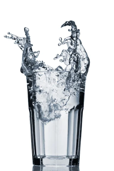 Water splash in faceted glass — Stock Photo, Image