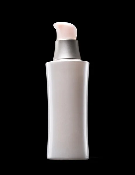 Белая бутылка косметики — стоковое фото