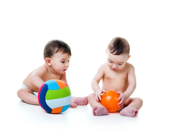 Hermanos gemelos con bolas brillantes — Foto de Stock