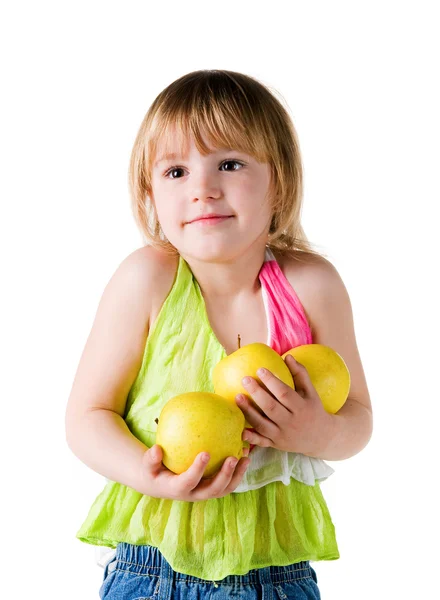 Маленька дівчинка з обіймами яблук — стокове фото