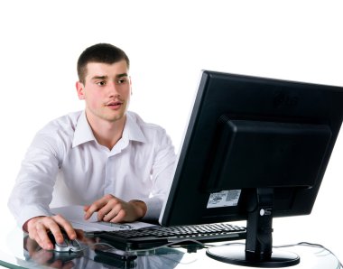 Businessmen sits at the computer clipart