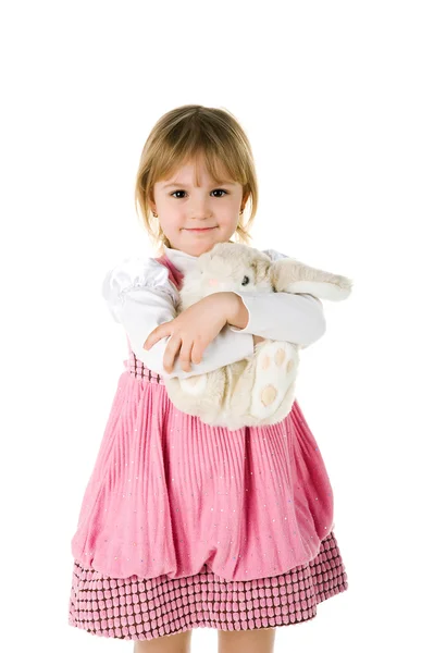 Kislány a vele nyúl játék — Stock Fotó