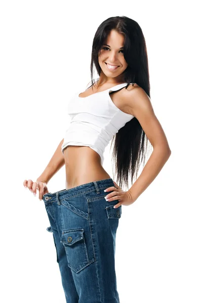 Giovane ragazza dimostrando la perdita di peso — Foto Stock
