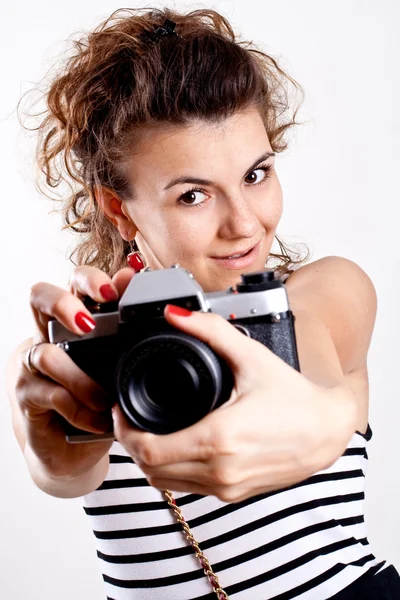 stock image Beautiful woman in a sailor's shirt with camera