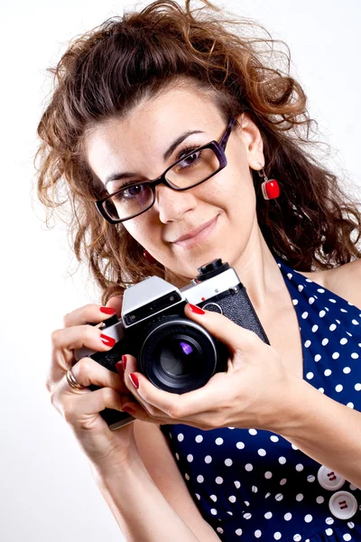 stock image Beautiful woman in a blue polka dot dress with camera