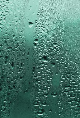 Natural water drops on glass clipart