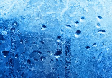 Frozen water drops on winter glass clipart