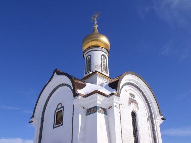 Church against the pure winter sky clipart