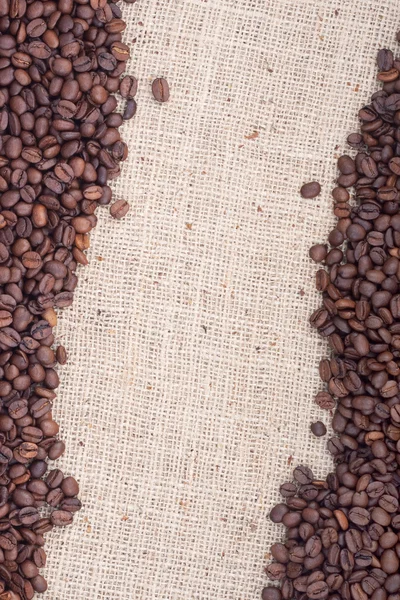 Grãos de café torrados castanhos. — Fotografia de Stock