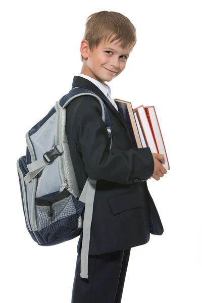 Junge hält Bücher in der Hand — Stockfoto