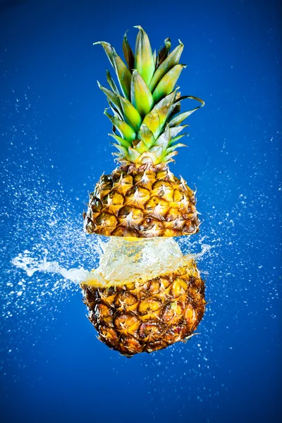 Pineapple splashed with water — Stock Photo, Image