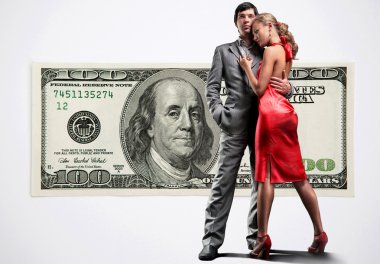 Young beautiful couple under money clipart