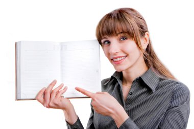 Beautiful businesswoman holding a diary in front of her. Specifi clipart