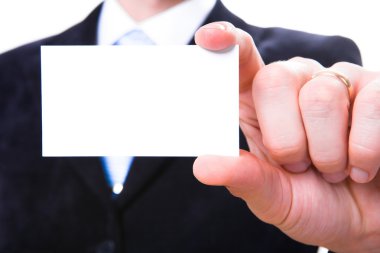 A studio shot of a businessman holding out a blank business card clipart