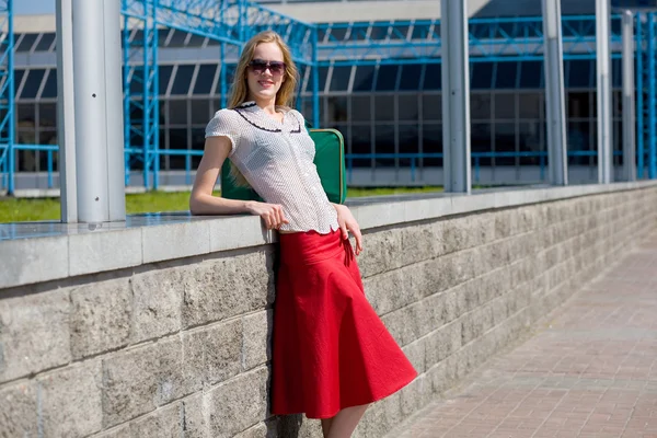 Smiling Sexy Blonde Girl Wearing Red Skirt Green Bag — Stock Photo, Image
