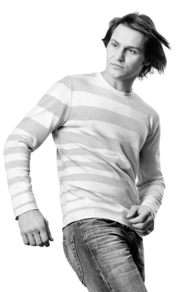 若い男性は現代的な服に身を包んだ。セーターとジーンズ. — ストック写真