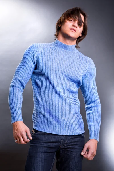 Young men dressed in modern clothes. Sweater of blue colour. — Stock Photo, Image