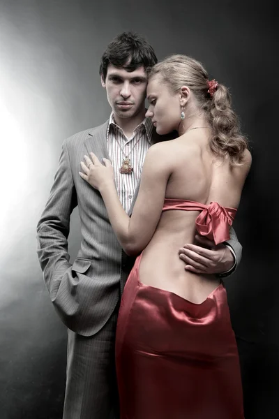 Portrait of a young beautiful couple. Young woman embraces man — Stock Photo, Image