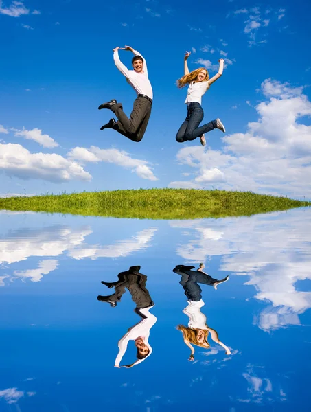 Happy Young Couple Team Jumping Sky Green Meadow — Stock Photo, Image