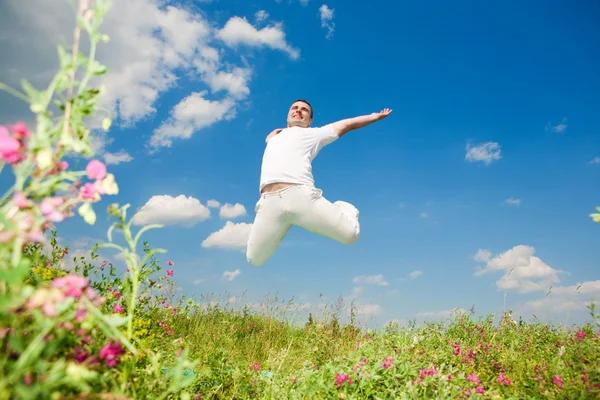Happy young man - jumping — Stock Photo, Image