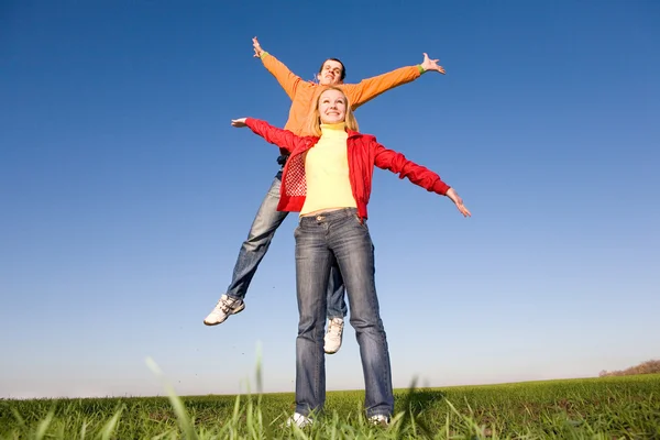 Happy Smiling Couple Jumping Blue Sky — Stock Photo, Image