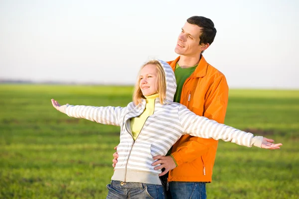 Happy smiling couple fly in sky — Stock Photo, Image