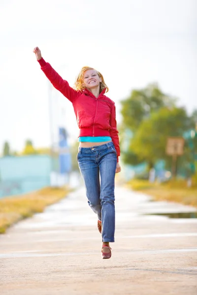 Young attractive happy girl running together outdoors — Stock Photo, Image