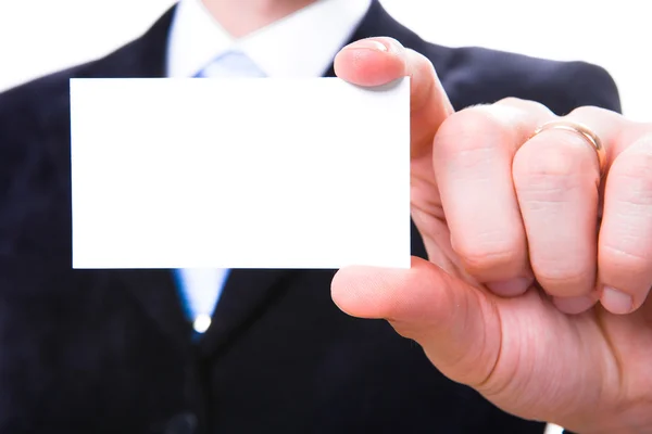 A studio shot of a businessman holding out a blank business card — Stock Photo, Image