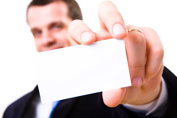 Una toma de estudio de un hombre de negocios sosteniendo una tarjeta de visita en blanco —  Fotos de Stock