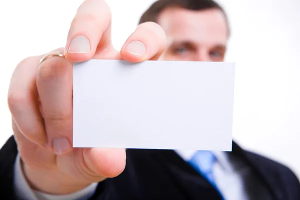Uma foto de estúdio de um empresário segurando um cartão de visita em branco — Fotografia de Stock