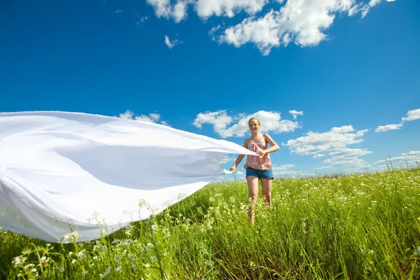Pretty girl having fun in the field Royalty Free Stock Images