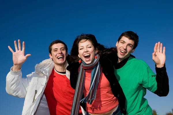开心的笑声的年轻团队 免版税图库照片
