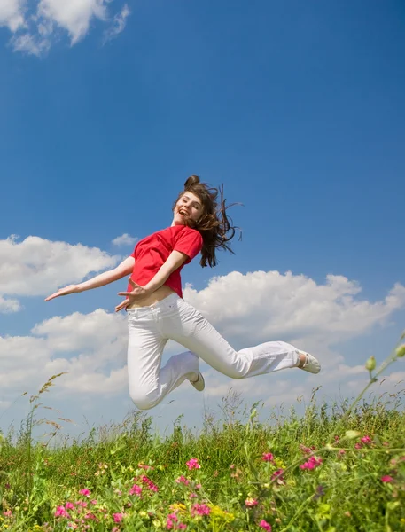 Happy young woman jumping Royalty Free Stock Images