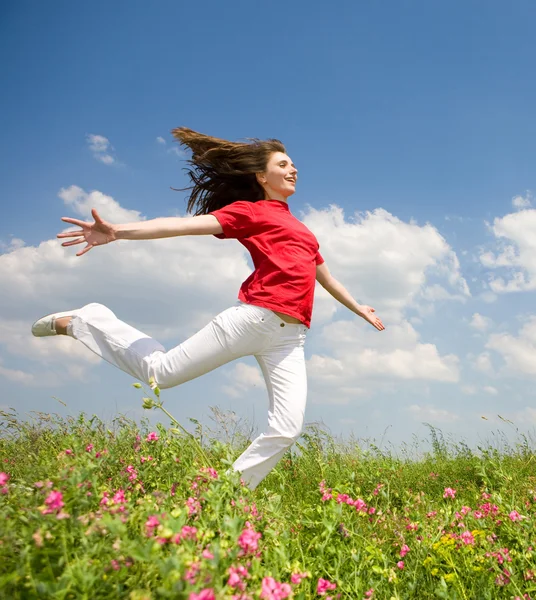Happy young woman jumping Stock Photo