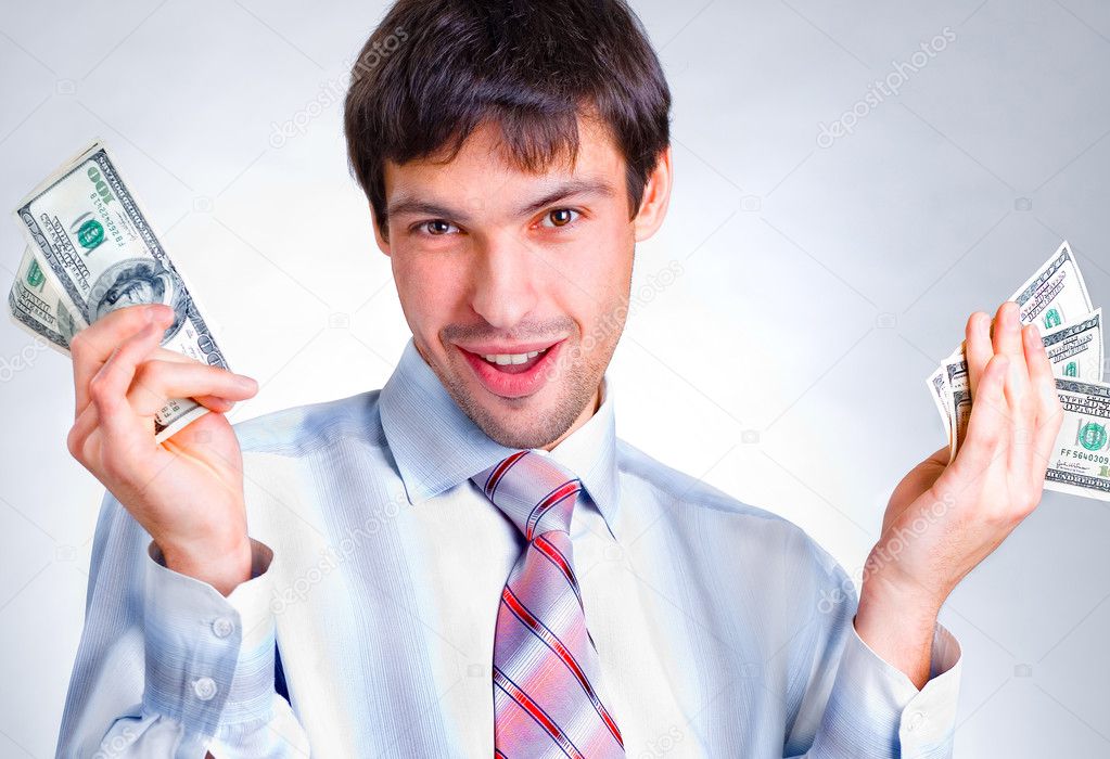 Businessman holds money in a hands