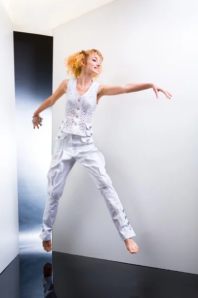 Young Woman Jumps Fun Studio — Stock Photo, Image