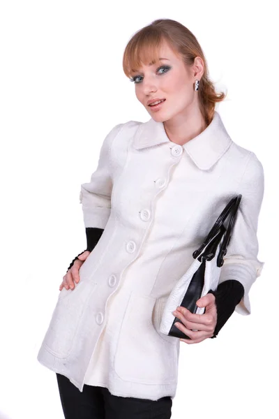 Mooie jonge vrouw in witte kleren op een witte achtergrond — Stockfoto