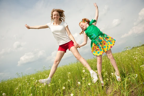 Mom and Daughter Having Fun in the field. Foces on eyes. — Stock Photo, Image